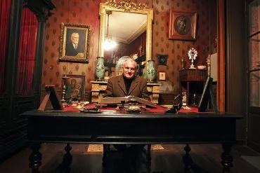 Illustration de J. Baudet dans le fauteuil de président de la SAHC